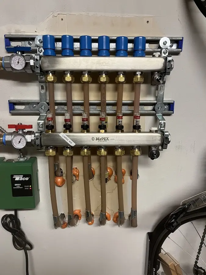 Plumber performing Water Heater Repair at a residential property in Erie